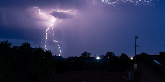lightning storm hitting a roof